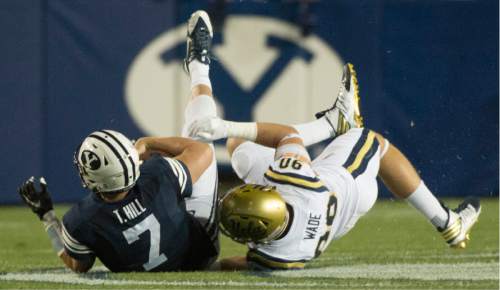 Rick Egan  |  The Salt Lake Tribune

Brigham Young quarterback Taysom Hill (7) is sacked by UCLA Bruins defensive lineman Rick Wade (90), in football action, BYU vs, UCLA, at Lavell Edwards Stadium, Saturday, September 17, 2016.