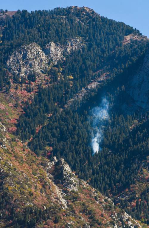Francisco Kjolseth | The Salt Lake Tribune
A small fire is spotted near the mouth of Big Cottonwood Canyon and is reported to being monitored by authorities on Monday, Sept. 19, 2016.
