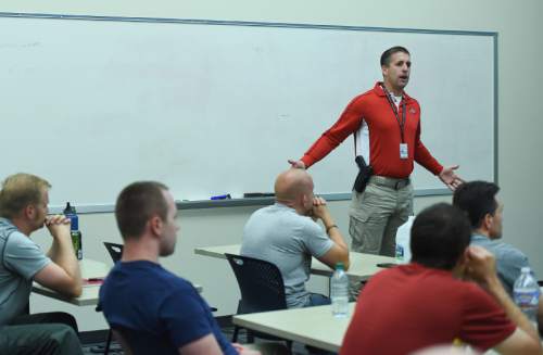 Francisco Kjolseth | The Salt Lake Tribune
Detective Kyler Prettyman discusses training tactics for disengagement with a class room full of police officers recently.