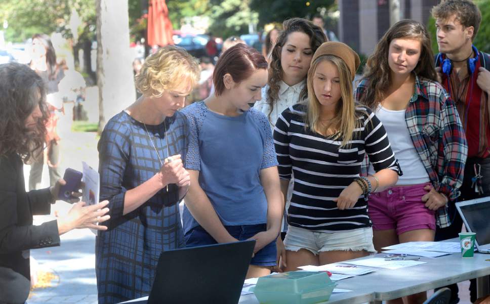 Al Hartmann  |  The Salt Lake Tribune
DeAnn Tilton, founder of Talk to a Survivor, far left, asks students to sign a pledge to believe and support friends that have been sexually assaulted during a gathering at Westminster College Monday September 19 for Start by Believing week September 19–22 across campus. It is the first time a full week of events on a Utah college campus will be devoted to the Start by Believing campaign. The movement is designed to help change the way people respond to sexual assault in the community.