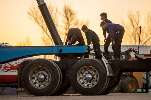 Trent Nelson  |  The Salt Lake Tribune
A man and three boys work on a semi truck in Colorado City, AZ, Thursday February 25, 2016.