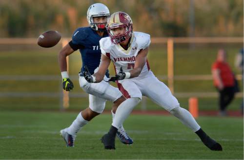 Scott Sommerdorf   |  The Salt Lake Tribune  
Viewmont WR Jacob Barnum turns to catch this first half pass with Syracuse DB Nj Mo'o ready to make the tackle. Syracuse beat Viewmont 13-6, Friday, September 16, 2016.