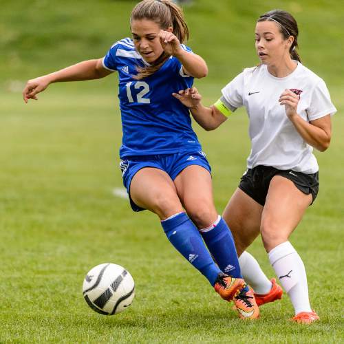 Trent Nelson  |  The Salt Lake Tribune
Fremont's Aubrey VanOrden (12) and Weber's Mylee Broad as Weber hosts Fremont high school soccer in Ogden, Thursday September 22, 2016.