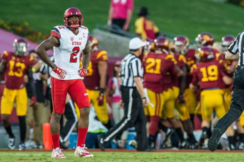 Chris Detrick  |  The Salt Lake Tribune
Utah Utes wide receiver Kenneth Scott (2) walks off of the field as USC Trojans celebrate a touchdown during the game at the Los Angeles Memorial Coliseum Saturday October 24, 2015.
