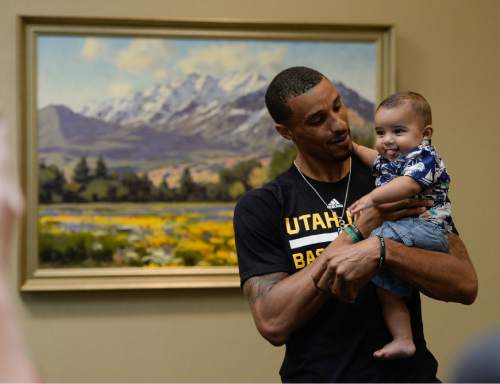 Francisco Kjolseth | The Salt Lake Tribune
The Utah Jazz introduce their new point guard, George Hill, who snuggles his 5-month-old son Zayden. Hill was officially acquired from the Pacers yesterday after a deal was struck in the days leading up to the NBA draft.