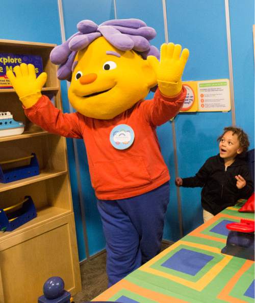Rick Egan  |  The Salt Lake Tribune

Decker Holder, 5 plays with Sid the Science Kid at the Discovery Gateway, Friday, September 23, 2016. The Sid the Science Kid: The Super-Duper Exhibit! brings the award-winning PBS Kids TV series to life. The public opening is Saturday at 11:00 am.