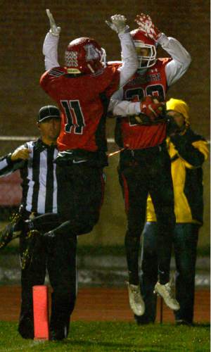 Leah Hogsten  |  The Salt Lake Tribune
American Fork's Chase Roberts celebrates his touchdown pass with Ashton Coleman. Sixth ranked American Fork High School football team defeated 18th ranked Lehi High School 38-14 during their region four game in American Fork.