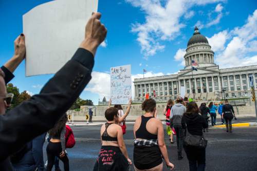 Chris Detrick  |  The Salt Lake Tribune
Participants walk to the state Capitol during the 5th annual SlutWalk Walk of No Shame Saturday September 24, 2016. The annual SlutWalk is a march against sexual assault, victim blaming, slut shaming, and rape culture- with millions of participants in thousands of cities around the globe. The Walk of No Shame aims to strike down the ideas that survivors of sexual assault or violence somehow deserved it, or that anyone is inviting this behavior. By dismantling this idea, and the culture that surrounds it, we hope to see better access to help for survivors, better reporting methods, and less stigma around reporting these crimes.