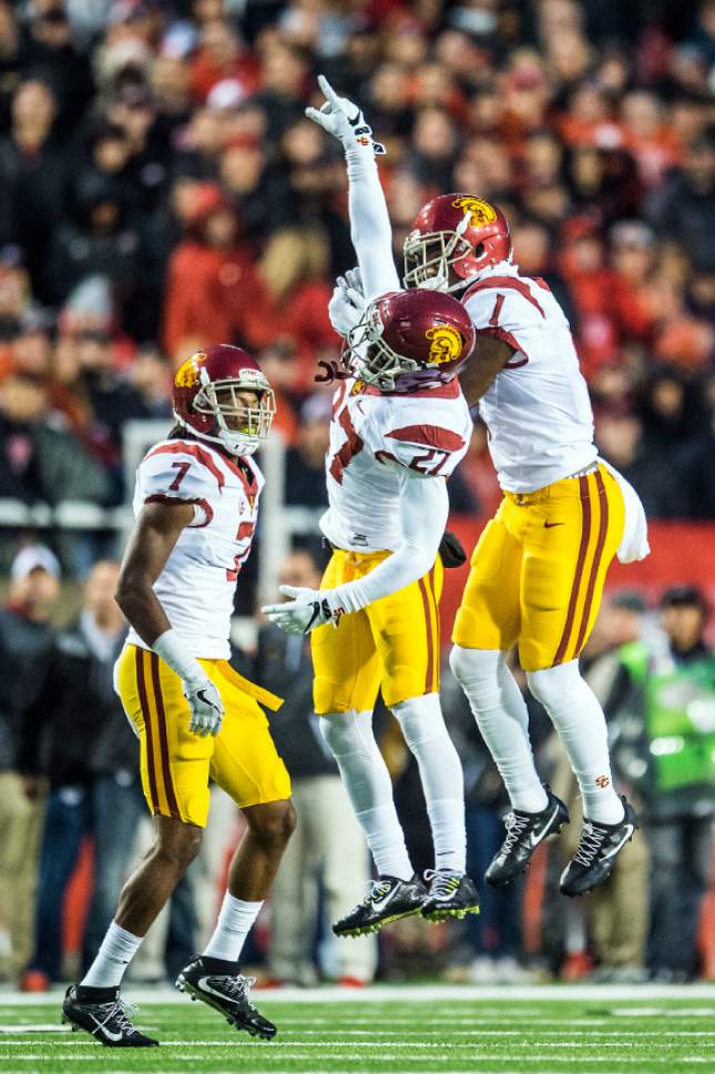 Chris Detrick  |  The Salt Lake Tribune
USC Trojans defensive back Marvell Tell III (7) USC Trojans defensive back Jack Jones (1) and USC Trojans running back Lance Mudd (27) celebrate after recovering a fumble during the first half of the game at Rice-Eccles Stadium Friday September 23, 2016.