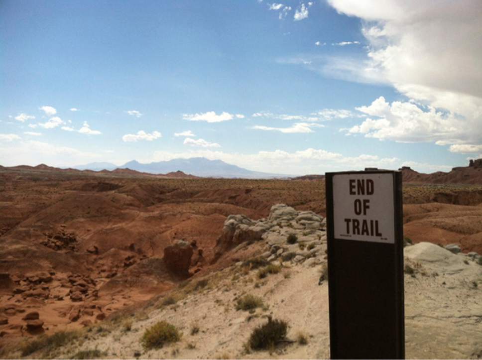 Nate Carlisle  |  The Salt Lake Tribune 

A sign marks the end of the Curtis Bench Trail in Goblin Valley State Park. The trail concludes with a view of Goblins on the valley below and the Henry Mountains in the distance.