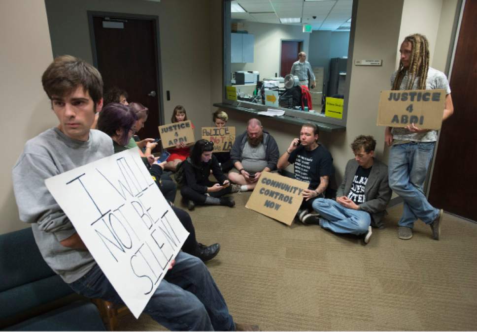 Steve Griffin / The Salt Lake Tribune


Utah Against Police Brutality members sit-in at Salt Lake County District Attorney Sim Gillís office to demand that Gill drop charges against Abdi Mohamed, who was shot and wounded by police shot during an altercation by the SLC homeless shelter on Feb. 27, 2016. The sit in was at the Broadway Centre building in Salt Lake City Monday September 26, 2016.