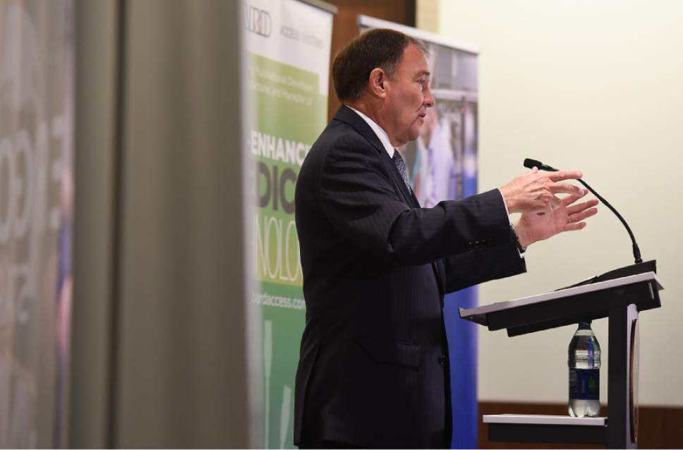 Francisco Kjolseth | The Salt Lake Tribune
Gov. Gary Herbert joins a press conference at Edwards Lifesciences in Draper for a new Medical Innovations Pathways (MIP) program, which will provide students the opportunity to receive a manufacturing certificate while in high school.