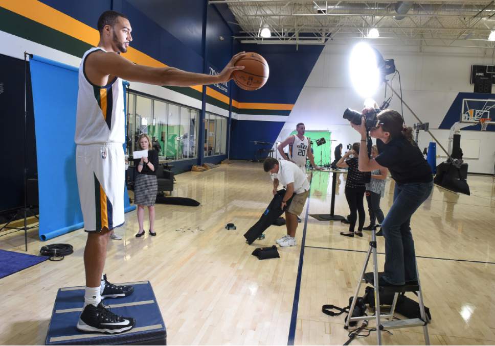 Francisco Kjolseth | The Salt Lake Tribune
Rudy Gobert stands in front of the flash for team photographer Melissa Majchrzak as the Utah Jazz opens training camp with media day for players at the team's training facility in Salt Lake on Monday, Sept. 26, 2016.