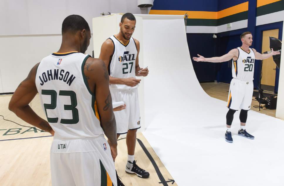 Francisco Kjolseth | The Salt Lake Tribune
Players Chris Johnson, Rudy Gobert and Gordon Hayward, from left, take turns on the backdrop as the Utah Jazz opens training camp with media day for players at the team's training facility in Salt Lake on Monday, Sept. 26, 2016.