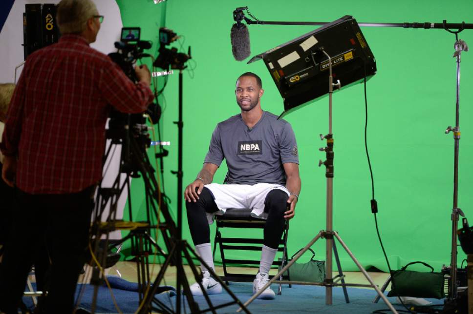 Francisco Kjolseth | The Salt Lake Tribune
Chris Johnson takes a seat in front of the green screen for future promotions as the Utah Jazz opens training camp with media day for players at the team's training facility in Salt Lake on Monday, Sept. 26, 2016.