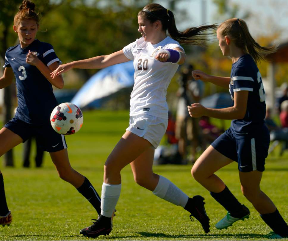Leah Hogsten  |  The Salt Lake Tribune
Davis' Lindsay DiReda dribbles past Hunter. Davis High School girls' soccer program, currently ranked No. 1 nationally by USA Today, established the new UHSAA record for most consecutive wins with their 37th straight win against Hunter High School 13-0, September 27, 2016.