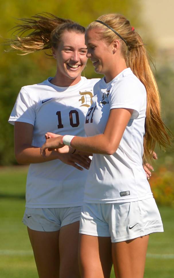 Leah Hogsten  |  The Salt Lake Tribune
Davis' Olivia Wade and Mikayla Colohan celebrate a goal. Davis High School girls' soccer program, currently ranked No. 1 nationally by USA Today, established the new UHSAA record for most consecutive wins with their 37th straight win against Hunter High School 13-0, September 27, 2016.