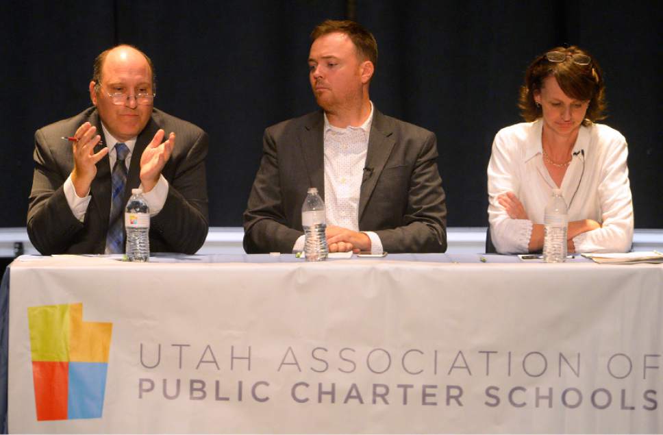 Leah Hogsten  |  The Salt Lake Tribune
Ethan Millard (center) moderates the debate between the Utah State Board of Education's District 4 candidates, Dave Thomas, the incumbent school board vice-chairman, and Jennifer Graviet, an English teacher at Sandridge Junior High School in front of a dozen people in attendance at Syracuse Arts Academy, September 27, 2016.  The event was organized by the Utah Association of Public Charter Schools.