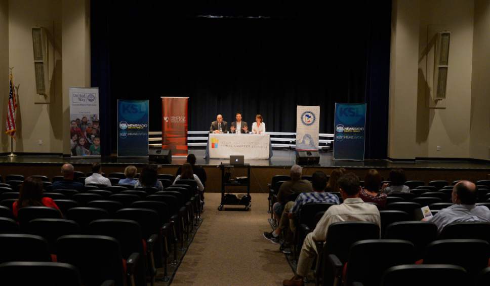 Leah Hogsten  |  The Salt Lake Tribune
Debate moderator Ethan Millard (center) fields questions to the Utah State Board of Education's District 4 candidate Dave Thomas, the incumbent school board vice-chairman, and Jennifer Graviet, an English teacher at Sandridge Junior High School in front of a dozen people in attendance at Syracuse Arts Academy, September 27, 2016.  The event was organized by the Utah Association of Public Charter Schools.