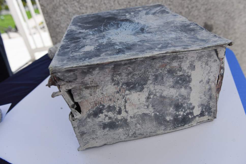 Francisco Kjolseth | The Salt Lake Tribune
After over 100 years, the Utah Capitol has revealed one of its secrets when a time capsule encased in the granite below a front column on April 4th 1914, was pulled out by crews on Wednesday, Sept. 28, 2016. Soon the metal box will be opened as part of a ceremony.