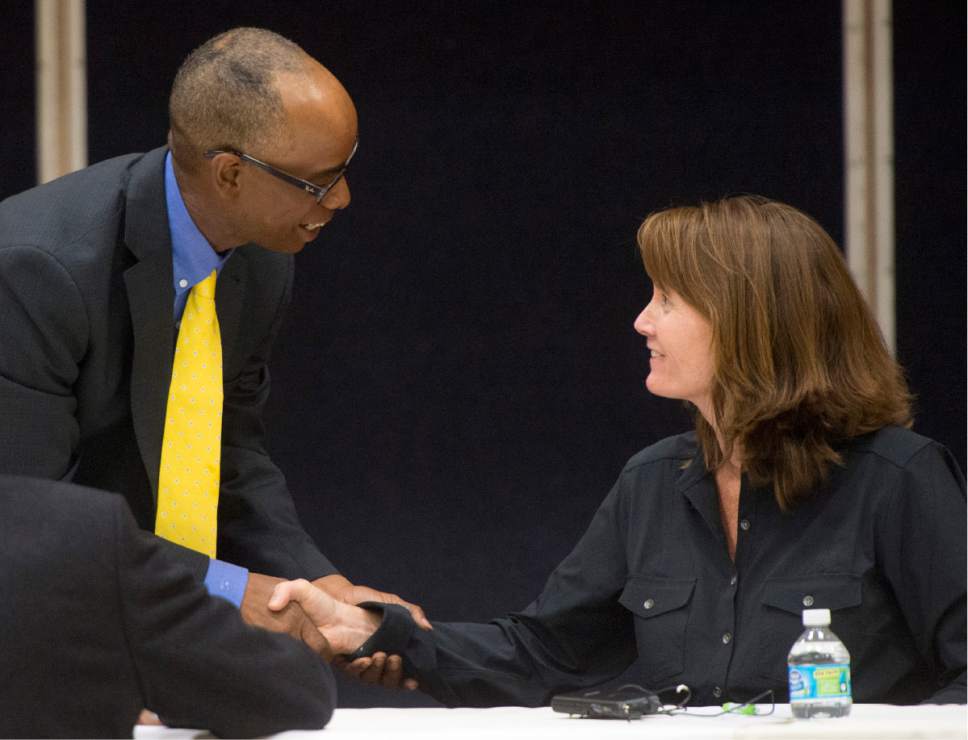 Rick Egan  |  The Salt Lake Tribune

Gary Thompson shakes hands with Kathleen Riebe, after the two candidates for state school board District 10 participated in a debate at Channing Hall in Draper, Wednesday, September 28, 2016.