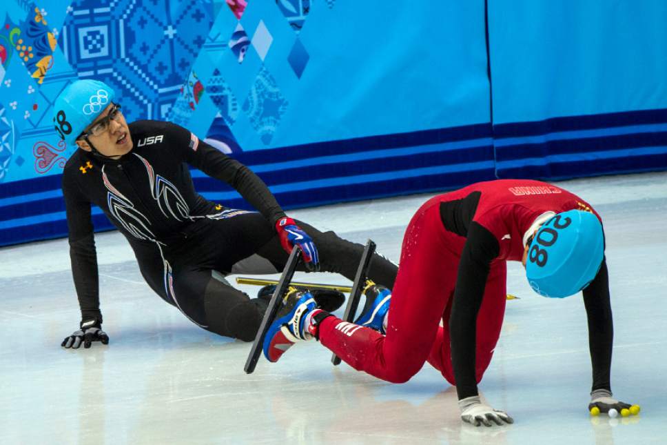 J.R. Celski, of Salt Lake City, and Dequan Chen, of China, (208) fall after finishing in the 1,500-meter short-track speedskating finals at Iceberg Skating Palace during the 2014 Sochi Olympic Games Monday February 10, 2014. Celski finished in fourth place with a time of 2:15.624, 0.639 behind gold medalist Charles Hamelin of Canada. (Photo by Chris Detrick/The Salt Lake Tribune)