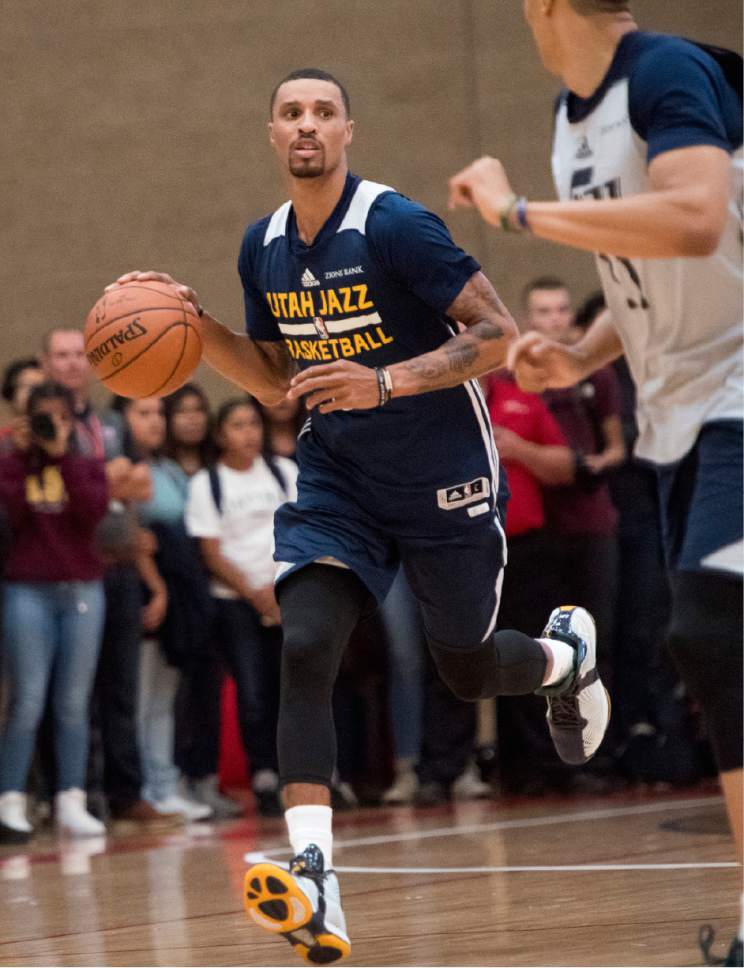 Rick Egan  |  The Salt Lake Tribune

George Hill brings the ball down court, as the Utah Jazz play a surprise scrimmage at Granger High School, Friday, September 30, 2016.