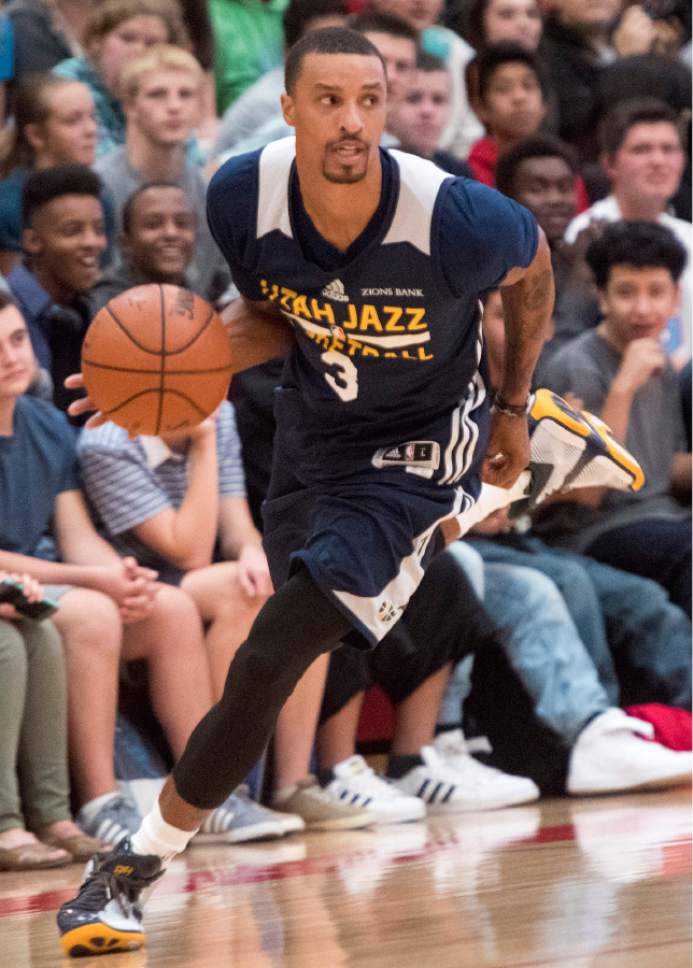 Rick Egan  |  The Salt Lake Tribune

George Hill leads a fast break, as the Utah Jazz play a surprise scrimmage at Granger High School, Friday, September 30, 2016.