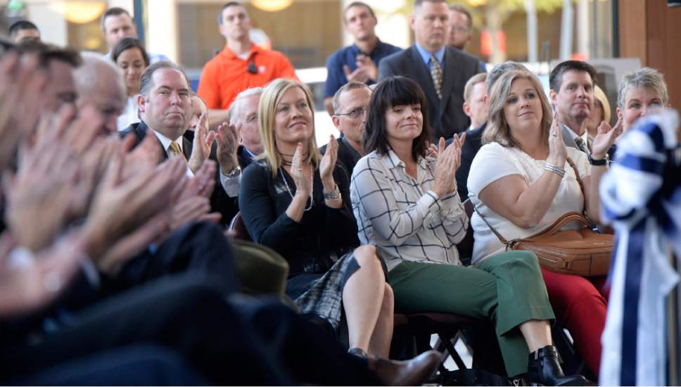 Al Hartmann  |  The Salt Lake Tribune
Guests applaud during the opening of Salt Lake City's new premier office tower, 111 Main on Thursday September 22.