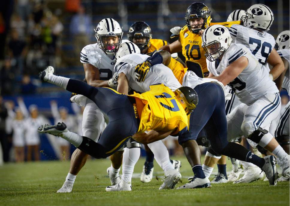 Scott Sommerdorf   |  The Salt Lake Tribune  
Toledo Rockets linebacker Tyler Taafe (17) flies through to sack BYU QB Taysom Hill late in the first half. BYU and Toledo were tied 21-21 at the half, Friday, September 30, 2016.