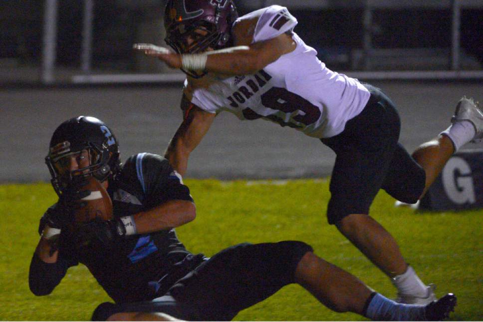 Leah Hogsten  |  The Salt Lake Tribune
West Jordan's Preston Michaelsen with the touchdown catch from 34-yards out. Jordan High School defeated West Jordan High School football team 41-35 in their Region 3 football game, September 30, 2016.