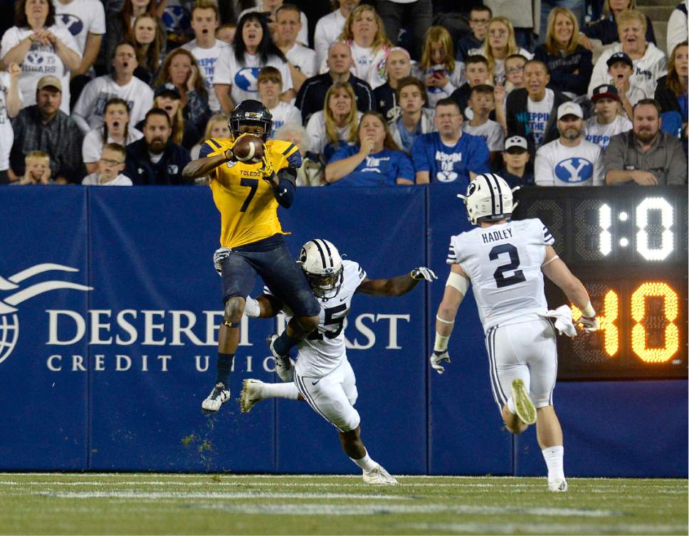 Scott Sommerdorf   |  The Salt Lake Tribune  
Toledo Rockets wide receiver Jon'Vea Johnson (7) catches a TD pass to give Toldeo a 38-35 lead over BYU in the third quarter. BYU defeated Toledo 55-53, Friday, September 30, 2016.