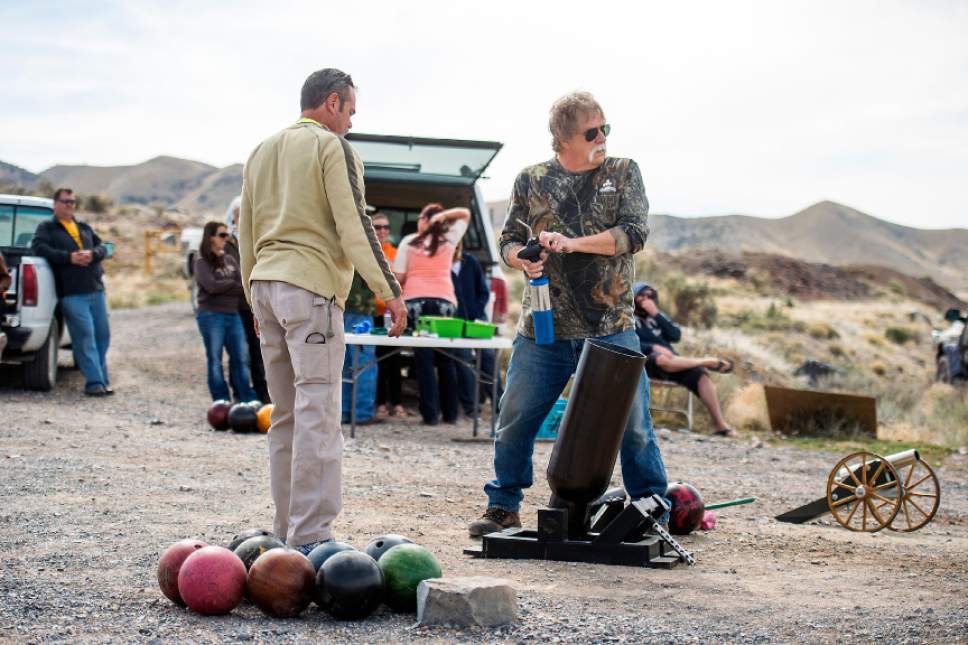 Chris Detrick  |  The Salt Lake Tribune
Robert Kirby and friend Sonny shoot bowling balls out of a cannon in Rush Valley Saturday March 21, 2015.