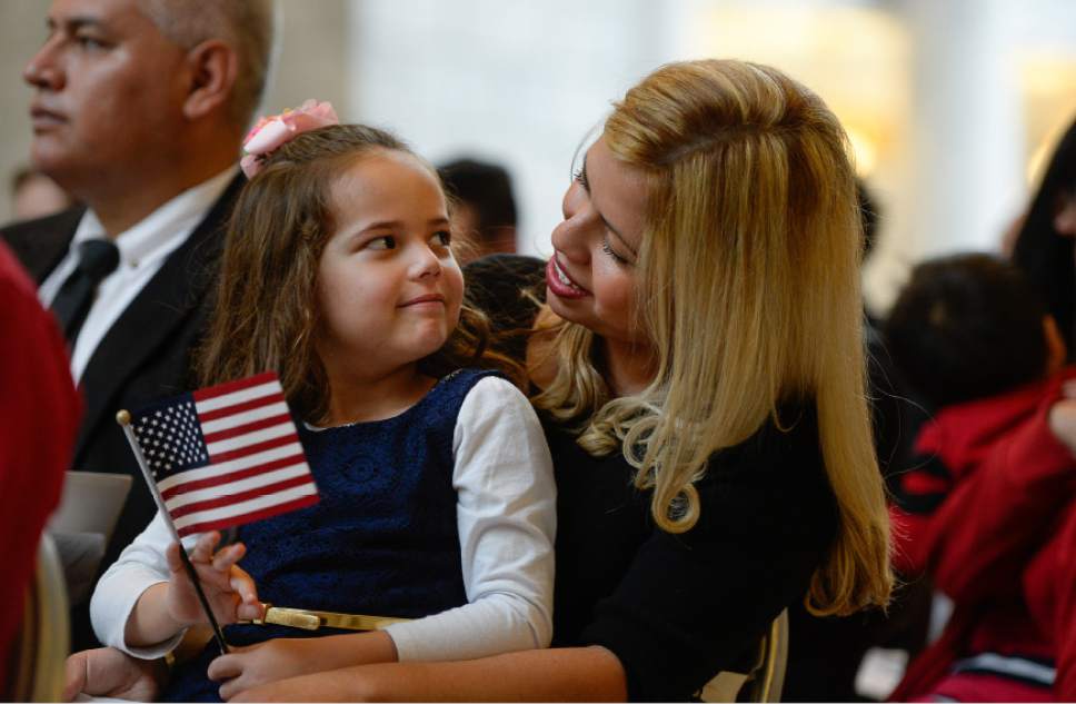 Francisco Kjolseth | The Salt Lake Tribune
Beatriz Cooper of Mexico embraces her daughter Ivy, 5, during a special naturalization ceremony held at the Utah Capitol on Friday, Sept. 30, 2016. The U.S. Citizenship and Immigration Services and Representative Norm Thurston hosted the ceremony for 132 citizenship applicants from 49 countries.