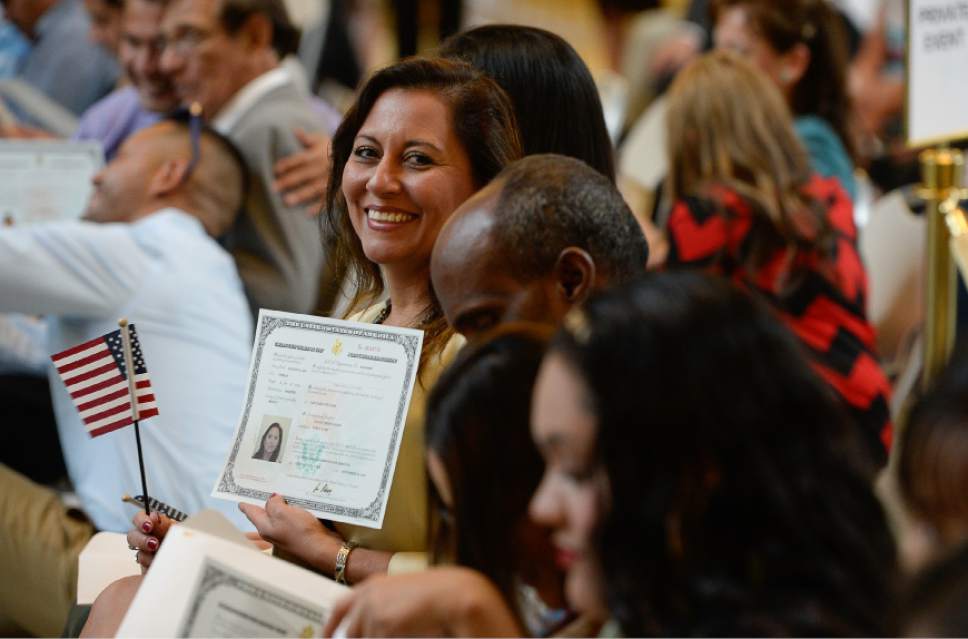 Francisco Kjolseth | The Salt Lake Tribune
Gissou Ceron of Mexico proudly holds her new certificate of U.S. citizenship during a ceremony at the Utah Capitol on Friday, Sept. 30, 2016. The U.S. Citizenship and Immigration Services hosted a naturalization ceremony for 132 citizenship applicants from 49 countries.