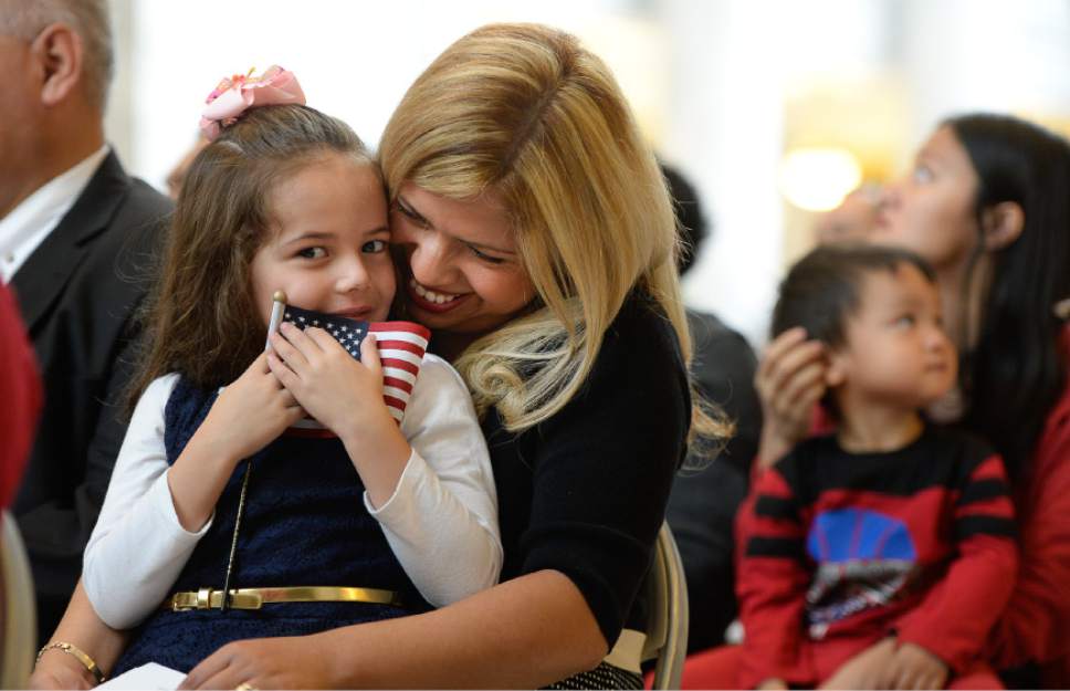 Francisco Kjolseth | The Salt Lake Tribune
Beatriz Cooper of Mexico embraces her daughter Ivy, 5, during a special naturalization ceremony held at the Utah Capitol on Friday, Sept. 30, 2016. The U.S. Citizenship and Immigration Services and Representative Norm Thurston hosted the ceremony for 132 citizenship applicants from 49 countries.