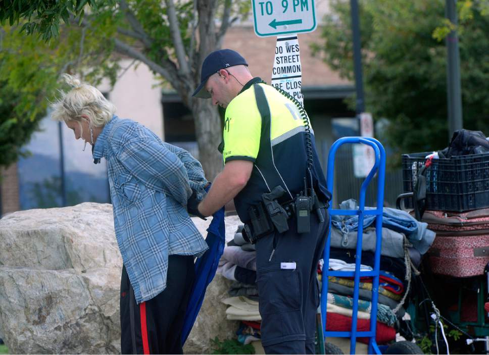 Al Hartmann  |  The Salt Lake Tribune
Salt Lake City Police check identifications and made arrests in a blitz of the Rio Grande neighborhood in downtown Salt Lake City Thursday September 29.  Here they handcuff and search a woman on the block of 500 West between 300 and 400 South where many homeless spend time during the day in lawn chairs, sleeping bags and their suitcases.