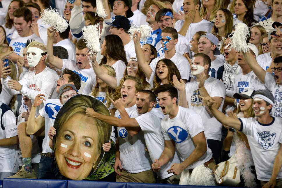 Scott Sommerdorf   |  The Salt Lake Tribune  
BYU fans celebrate with a cutout of Hillary Clinton as BYU led Toledo 21-14 at the end of the 1st quarter, Friday, September 30, 2016.