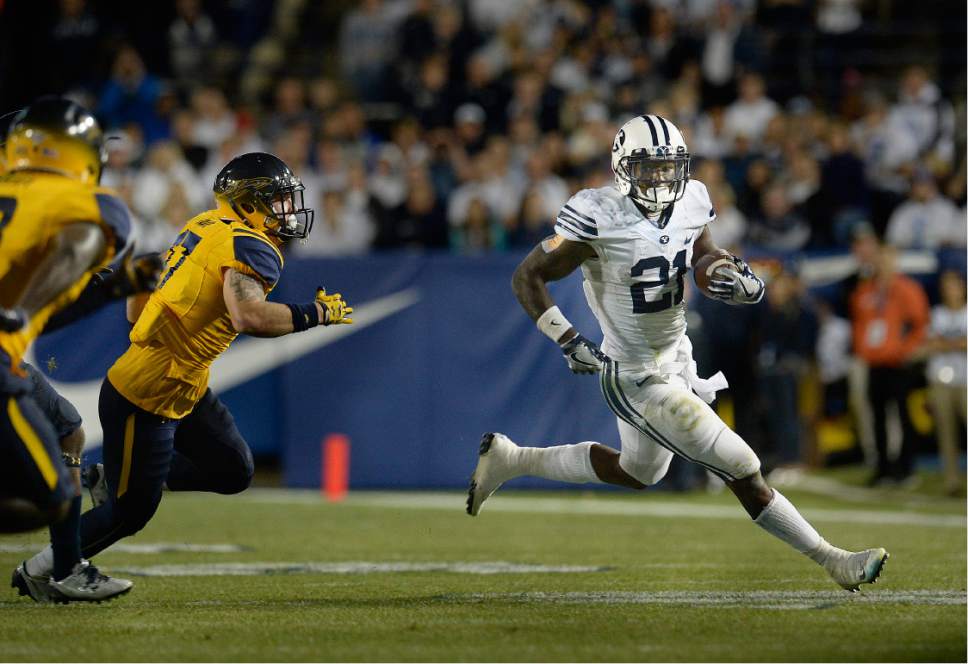 Scott Sommerdorf   |  The Salt Lake Tribune  
BYU RB Jamaal Williams (21) runs for some of his 286 yards rushing as BYU defeated Toledo 55-53, Friday, September 30, 2016. Williams also scored 5 TDs.