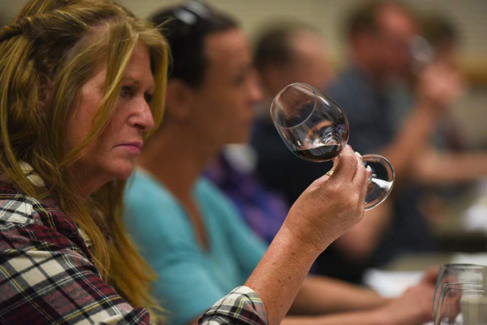 Francisco Kjolseth | The Salt Lake Tribune
Kathleen Jacobson, store manager for the liquor store in Sandy, makes a visual check on a sampled wine as part of a new wine training class that the DABC just started for Utah's liquor store employees.