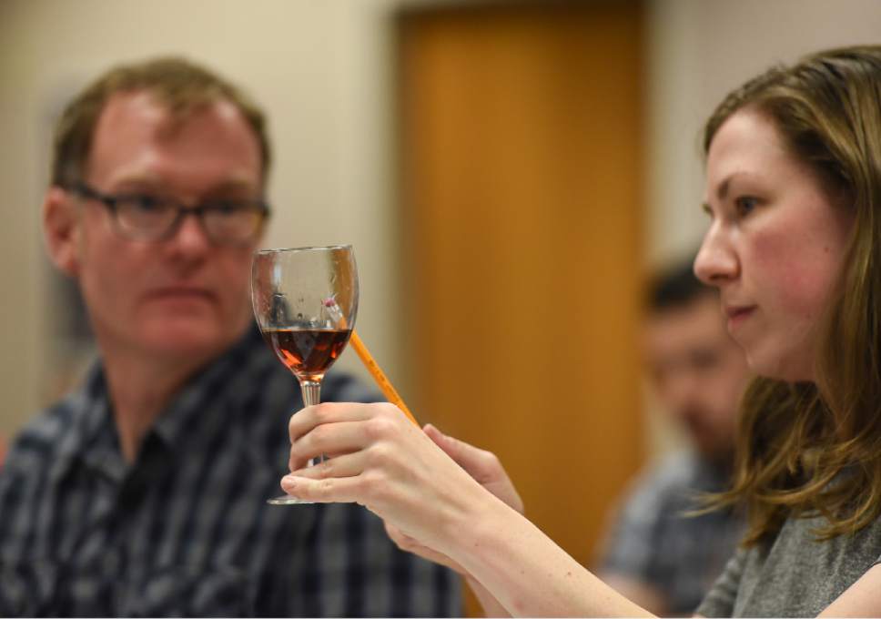 Francisco Kjolseth | The Salt Lake Tribune
Patrick Richardson and Jessica Mitchell, both employees of the Wine Store in Salt Lake City, look at the "legs" of a particular vintage during a training class that the DABC just started for Utah's liquor store employees. The Utah Department of Alcoholic Beverage Control got funding from the 2016 legislature for the training, something the public has been demanding for many years.