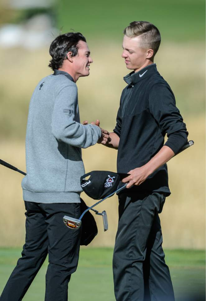 Francisco Kjolseth | The Salt Lake Tribune
Connor Howe of Weber right is congratulated by Elijah Turner of Lone Peak following his win during a tie breaker round in the class 5A boys' golf championships at Soldier Hollow in Midway.