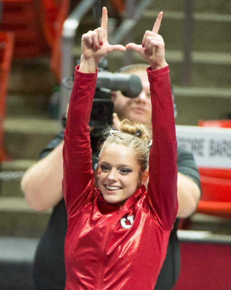 Rick Egan  |  The Salt Lake Tribune

Breanna Hughes salutes the crowd after winning the all around title, in the NCAA Regional Championships, at the Huntsman Center, Saturday, April 2, 2016.