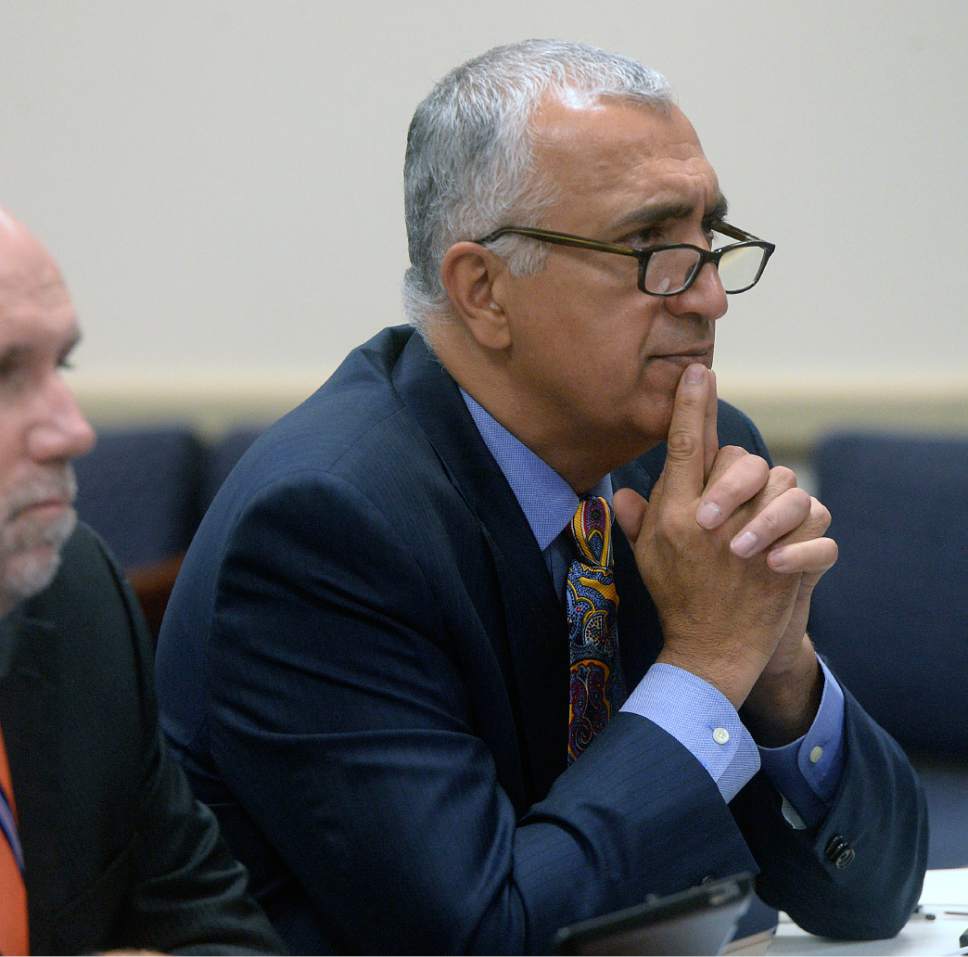 Al Hartmann  |  The Salt Lake Tribune
Salt Lake County District Attorney Sim Gill listens as Salt Lake County County Recorder Gary Ott comments on findings of the County Auditor's performance audit of his office Tuesday Oct. 4.