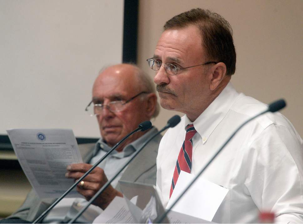 Al Hartmann  |  Tribune file photo
Salt Lake County Councilman Max Burdick listens as Salt Lake County County Recorder Gary Ott comments on findings of the County Auditor's performance audit of his office Tuesday Oct. 4.  Councilman Jim Bradley, left.