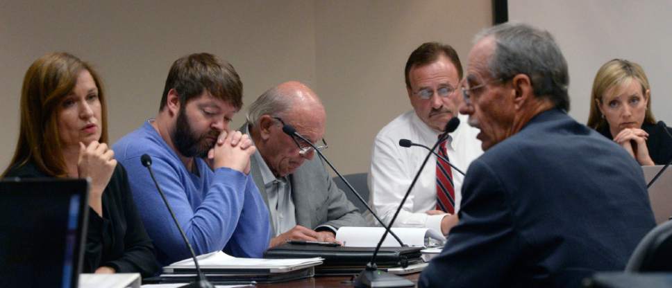 Al Hartmann  |  The Salt Lake Tribune
Salt Lake County County Recorder Gary Ott, right, speaks before a somber Salt Lake County Council on findings of the County Auditor's performance audit of his office Tuesday Oct. 4.  Councilwoman Jenny Wilson, left, is asking if he knows his street address.