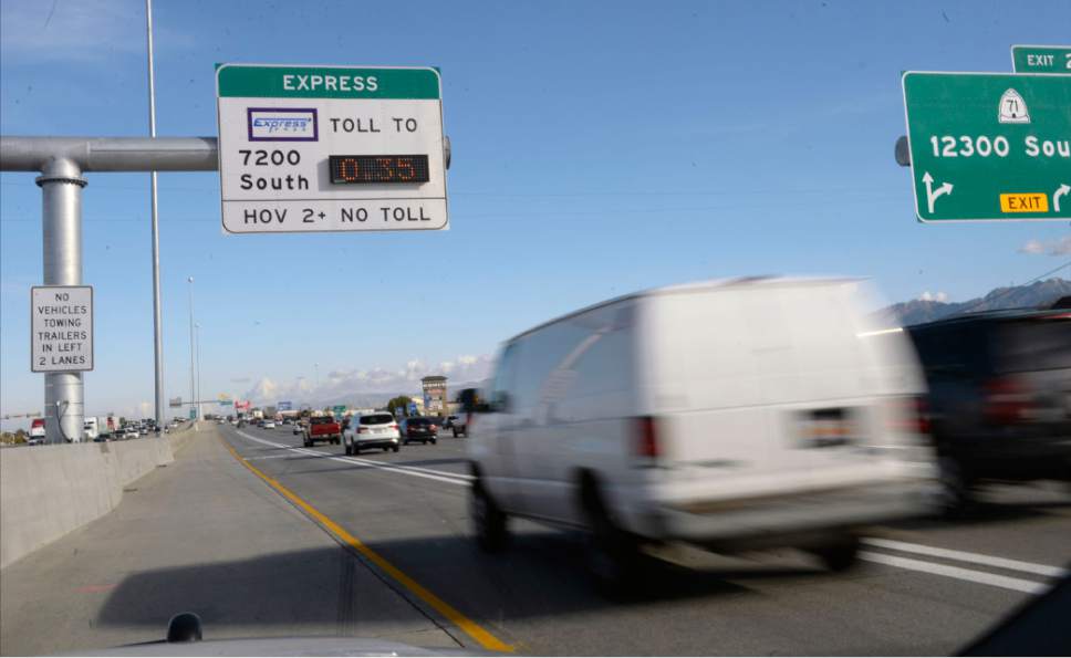 Al Hartmann  |  The Salt Lake Tribune
UHP Sgt. Danny Allen looks for cars illegally using the HOV lanes along I-15 in Salt Lake valley Wednesday Oct. 6. This van going by only had one passenger and didn't trigger the transponder reader that indicates an express pass.  It also had a CNG sticker that used to grant access to HOV lanes in the past but not necessarily now unless it's registered.   Utah Department of Transportation and Utah Highway Patrol are partnering and launching an enforcement blitz to educate drivers how to correctly use the express lanes.  Utah's Express Lanes are the longest continuous in the country stretching 72 miles from Layton to Spanish Fork.