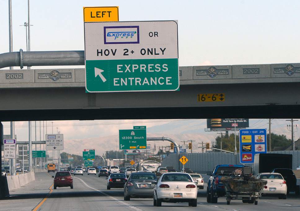 Al Hartmann  |  The Salt Lake Tribune
Moderate traffic spreads out using all lanes along I-15 near 12300 South including the far left HOV lane.  Department of Transportation and Utah Highway Patrol are partnering and launching an enforcement blitz to educate drivers how to correctly use the express lanes.  Utah's Express Lanes are the longest continuous in the country stretching 72 miles from Layton to Spanish Fork.