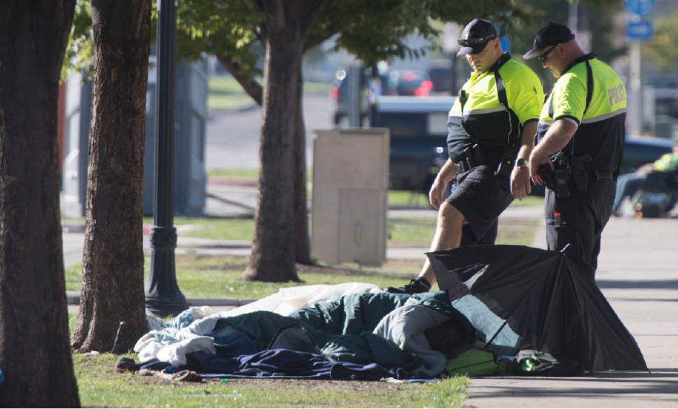 Rick Egan  |  The Salt Lake Tribune

Salt Lake City police make their rounds among the homeless people in the Rio Grande neighborhood Thursday, October 6, 2016.