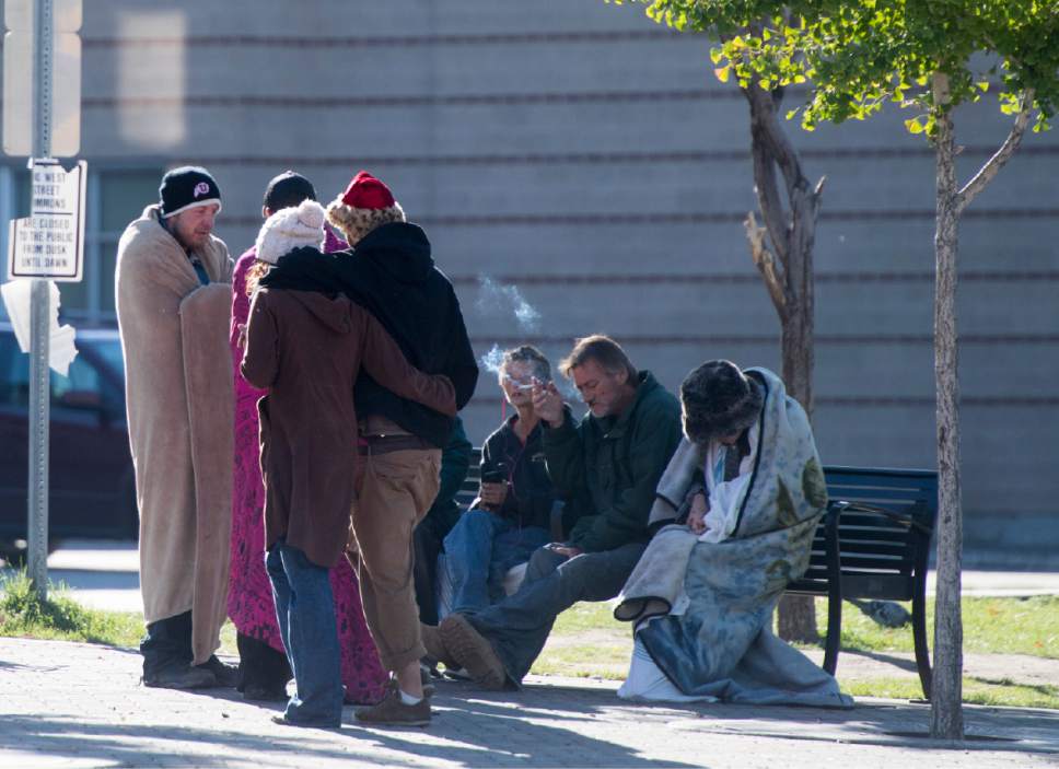 Rick Egan  |  The Salt Lake Tribune

Homeless people gather together in the Rio Grande neighborhood. Thursday, October 6, 2016.